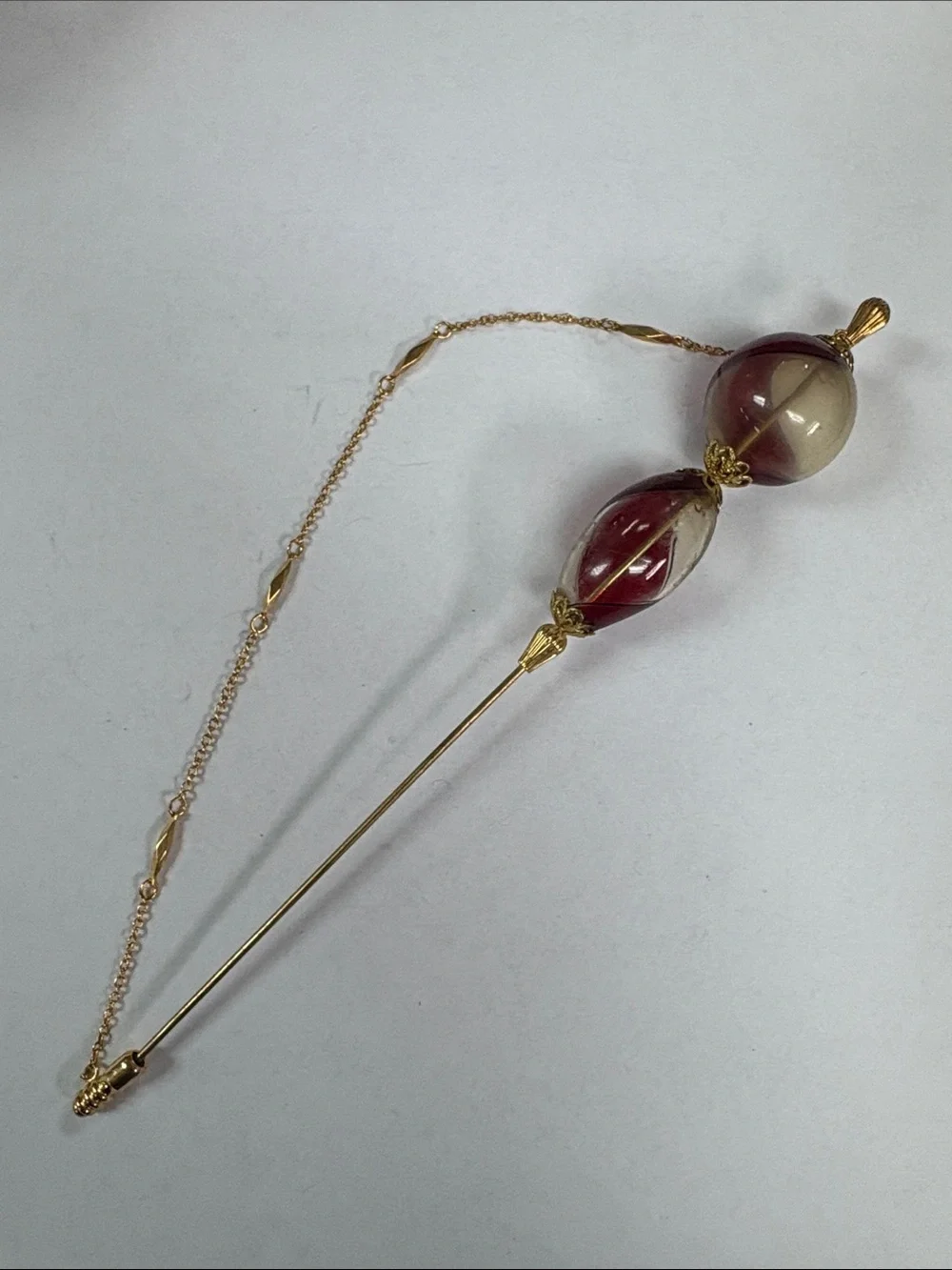 Gold-Tone Stick Brooch with Red and Cream Glass Beads